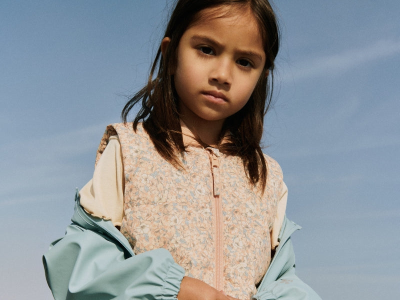 a girl outside with blue sky